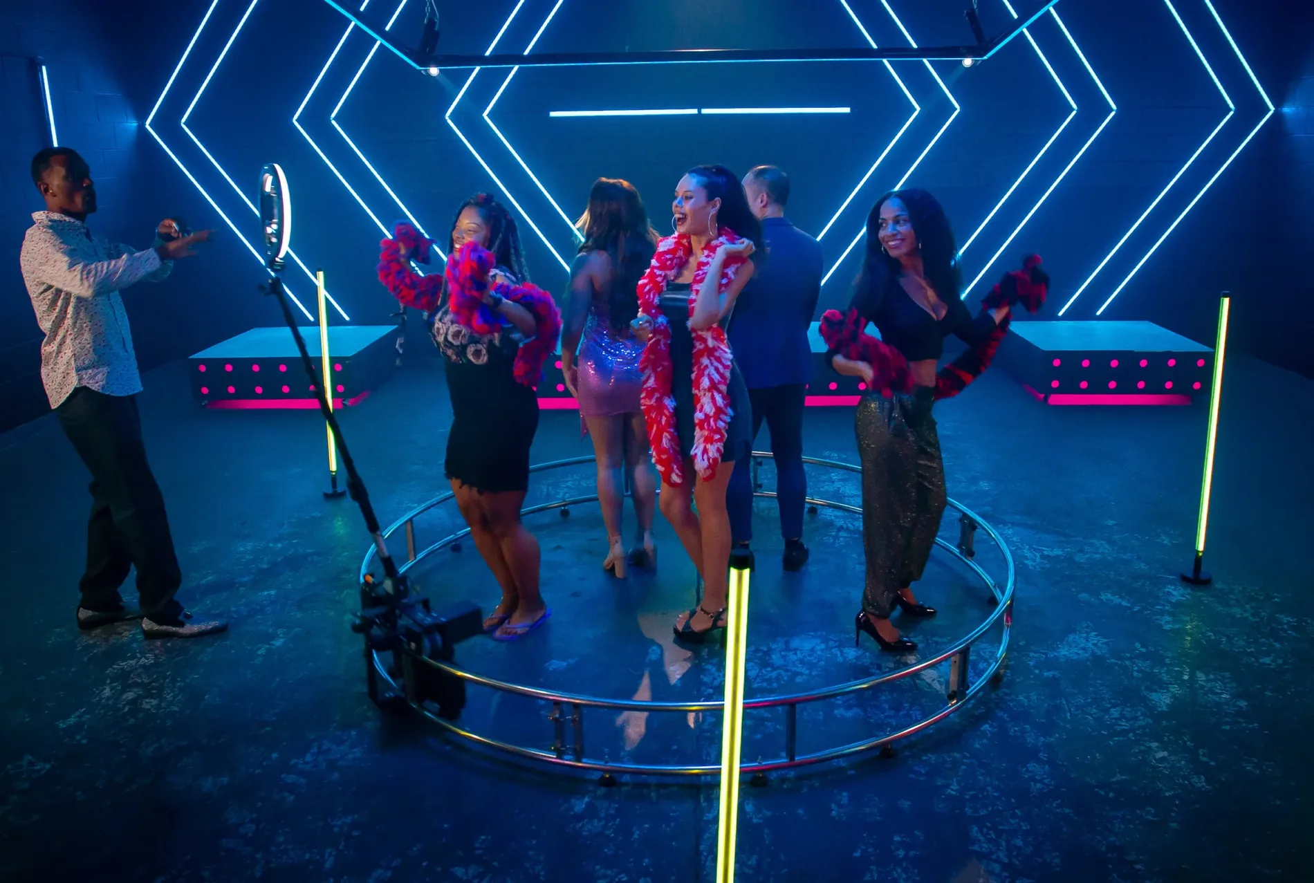 Guests posing on a 360 photo booth platform at a Chicago event