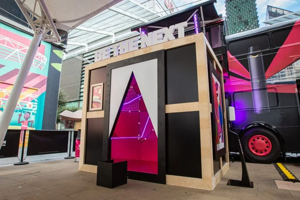 Colorful branded photo booth activation stand at a marketing event
