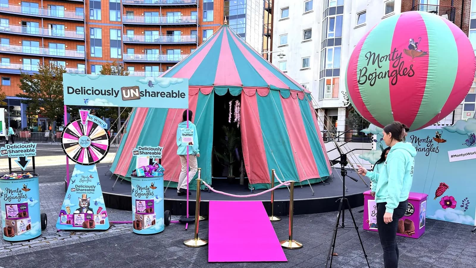 Branded photo booth activation inside a festival tent at an outdoor event