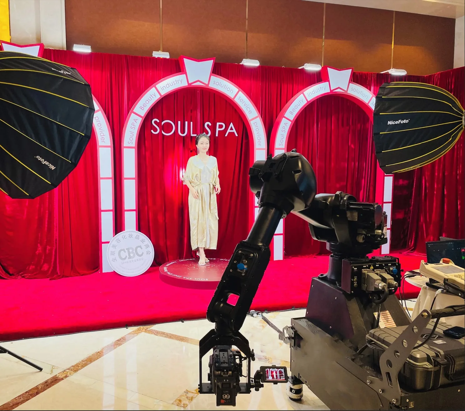 Glambot photo booth arm set up inside an event venue before guests arrive