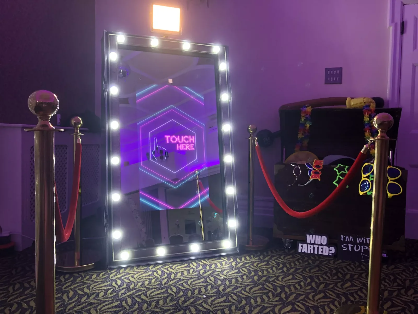 Mirror photo booth with an illuminated LED frame at a Chicago event venue