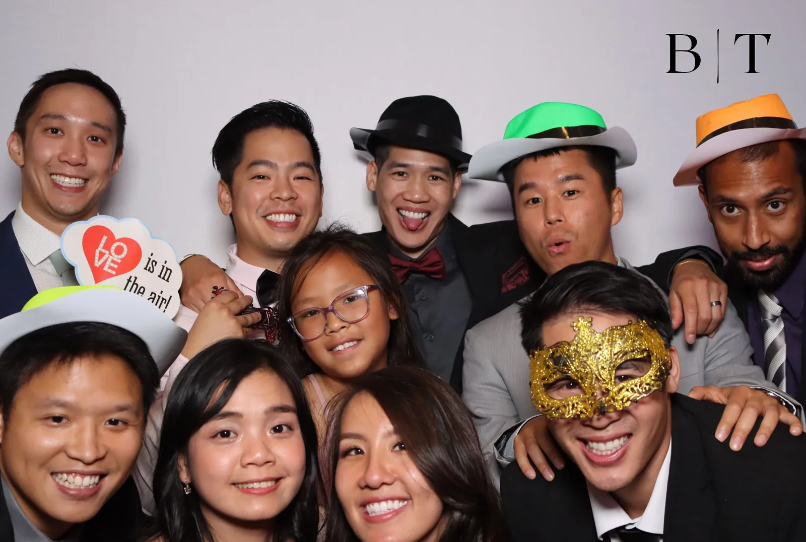 Group of guests wearing masquerade props at a Chicago photo booth
